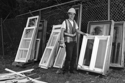 Professionals removing a sofa from a Norbury home